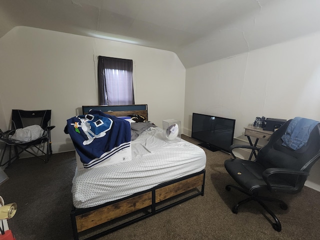 carpeted bedroom featuring lofted ceiling