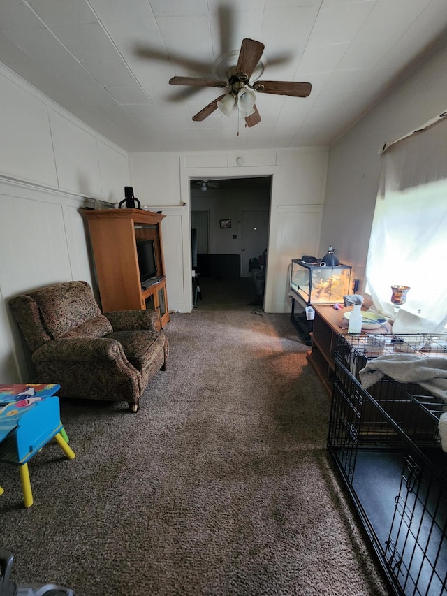 interior space with carpet and ceiling fan