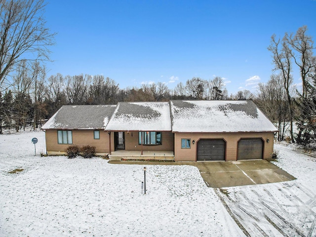 single story home with a porch and a garage