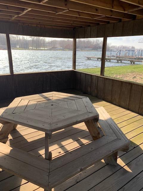 wooden deck with a water view