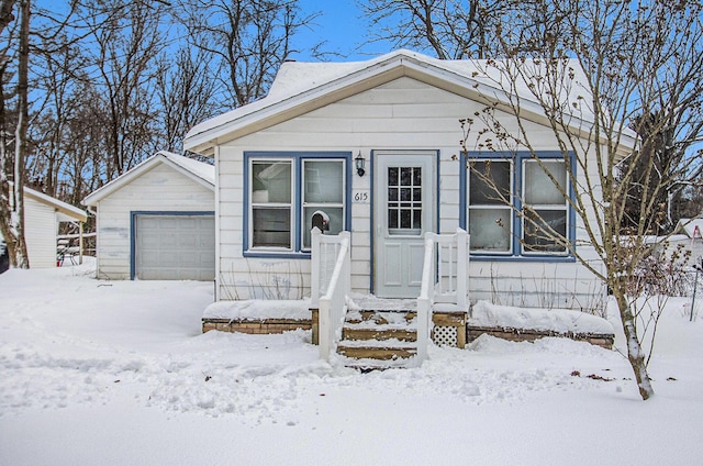 view of front of home with an outbuilding and a garage