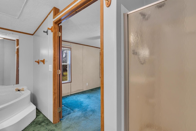 bathroom with vaulted ceiling, crown molding, plus walk in shower, and a textured ceiling