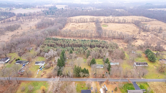 birds eye view of property with a rural view