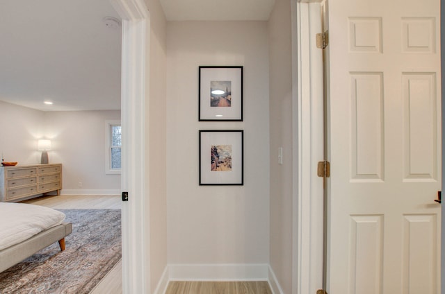 hallway with light wood-type flooring