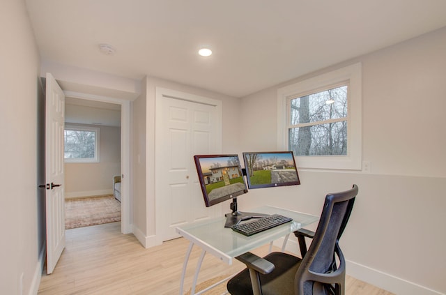 office area featuring plenty of natural light and light hardwood / wood-style floors