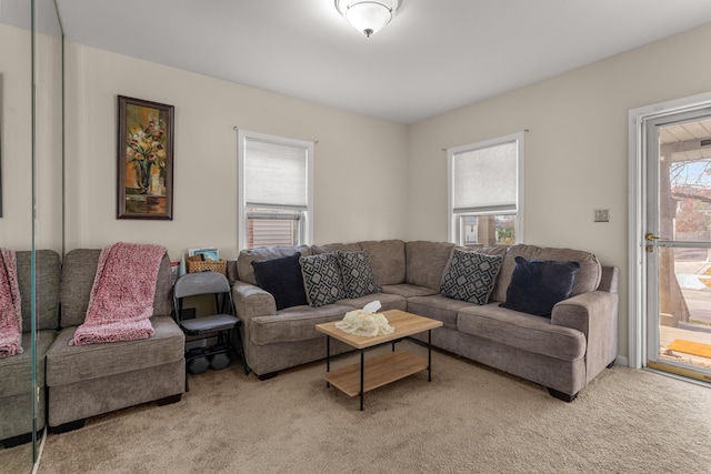 living room featuring light carpet