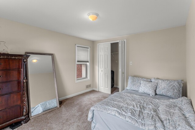 carpeted bedroom with a closet