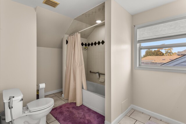 bathroom with tile patterned flooring, toilet, and shower / tub combo with curtain