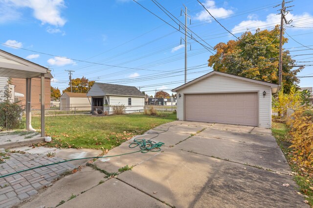 garage featuring a lawn