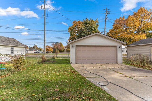 garage featuring a yard