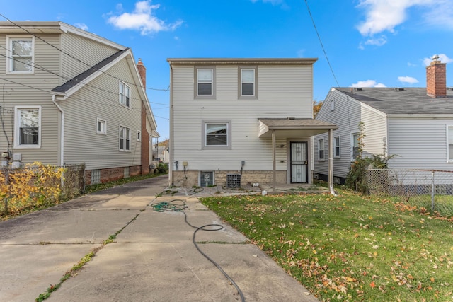 back of house with a yard