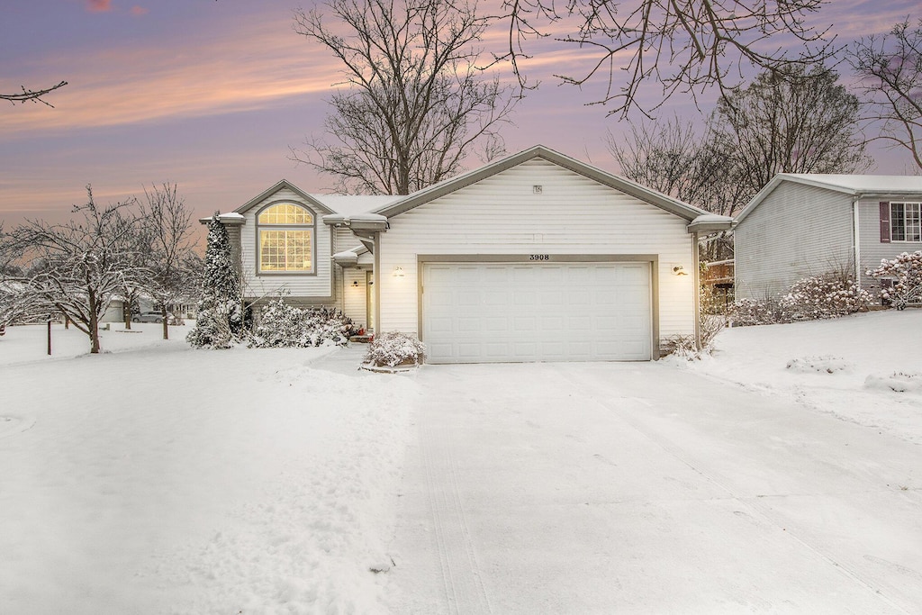 single story home featuring a garage