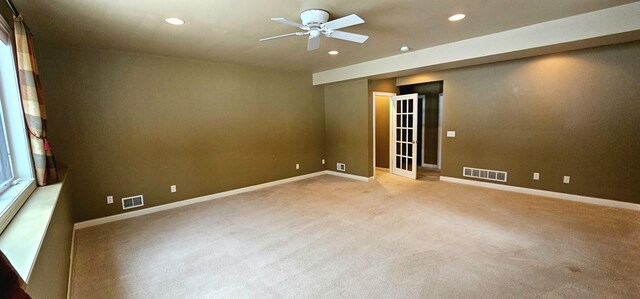 carpeted empty room with ceiling fan