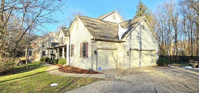 view of property exterior with a garage