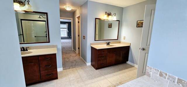 bathroom with tile patterned floors and vanity