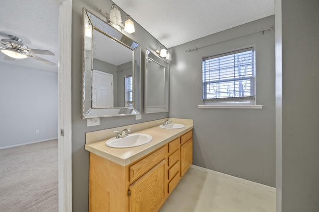 bathroom featuring ceiling fan and vanity