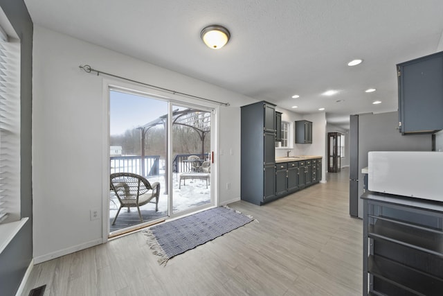 kitchen featuring sink and light hardwood / wood-style flooring