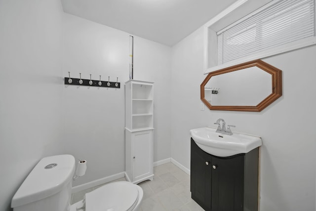 bathroom with toilet and vanity