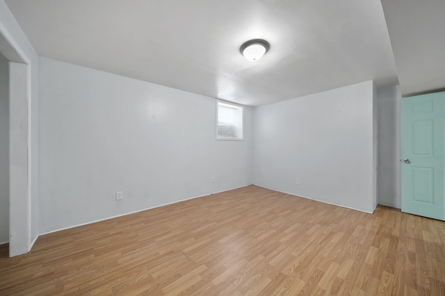 basement with light hardwood / wood-style floors