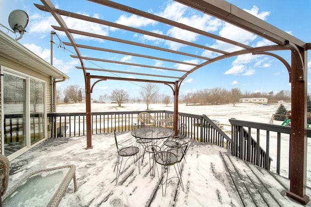 snow covered deck with a pergola