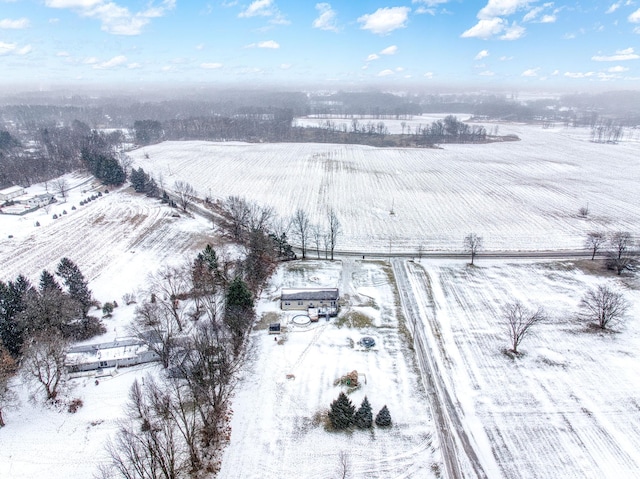 snowy aerial view featuring a rural view