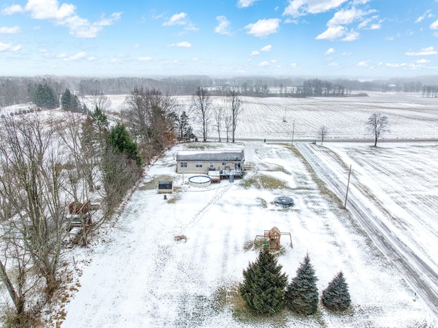 snowy aerial view featuring a rural view