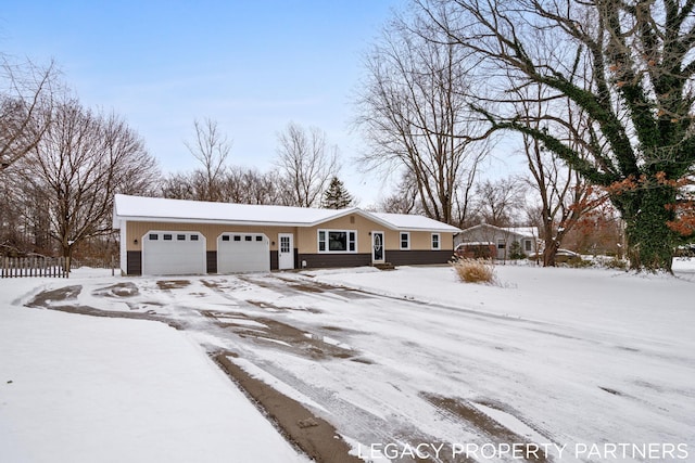 ranch-style home featuring a garage