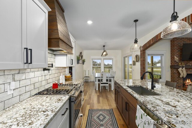 kitchen with sink, white cabinets, and stainless steel appliances