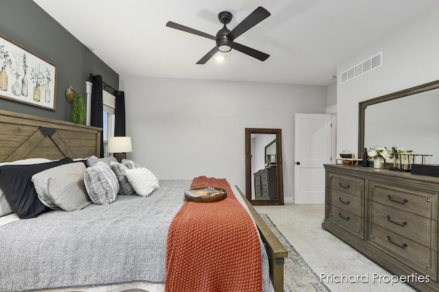 bedroom featuring ceiling fan and light carpet