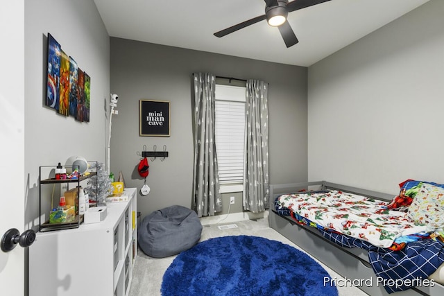 carpeted bedroom featuring ceiling fan and multiple windows