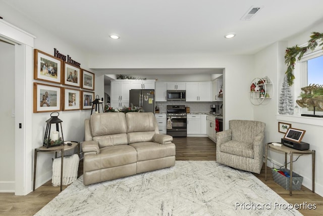 living room with dark wood-type flooring