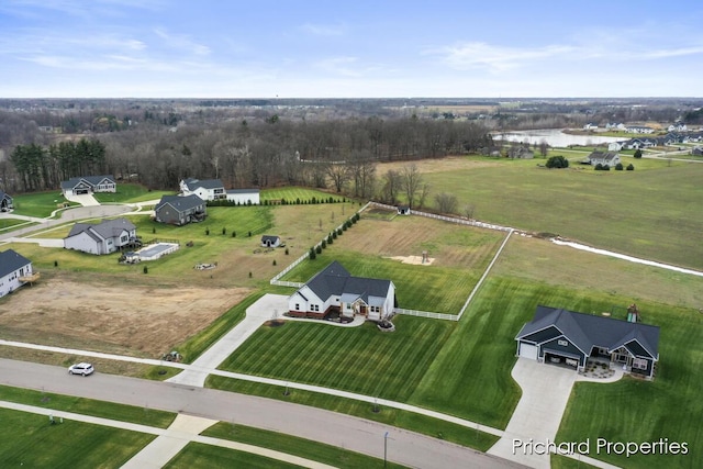 birds eye view of property with a rural view