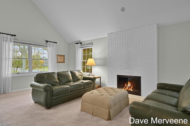 living room featuring plenty of natural light, light colored carpet, a fireplace, and high vaulted ceiling