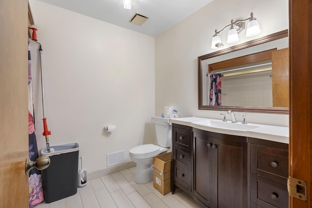 bathroom with vanity, toilet, and a shower with shower curtain