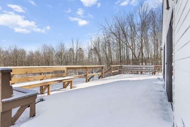 view of snow covered deck