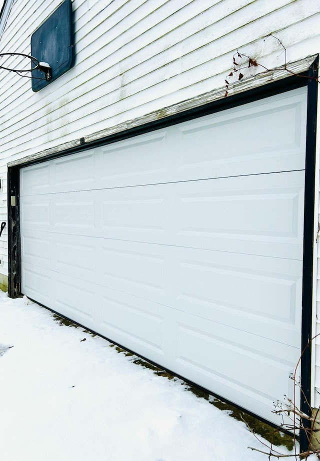 view of snow covered garage