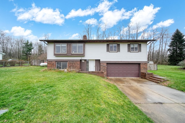 view of front of house with a garage and a front lawn