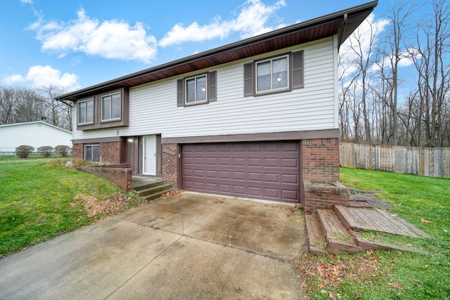 view of front of house featuring a garage and a front lawn