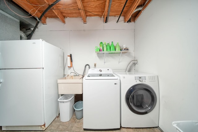 laundry room featuring washing machine and dryer