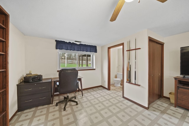 office space with ceiling fan and a textured ceiling