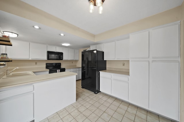 kitchen featuring white cabinetry, sink, kitchen peninsula, light tile patterned floors, and black appliances