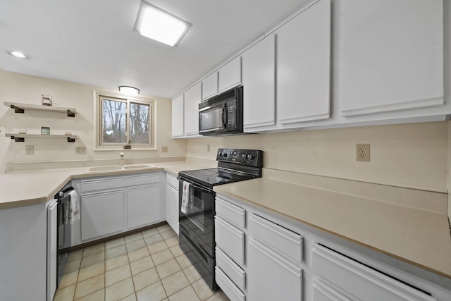 kitchen with white cabinetry, sink, light tile patterned floors, and black appliances