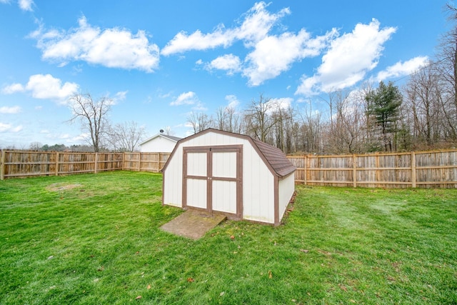 view of outbuilding with a yard