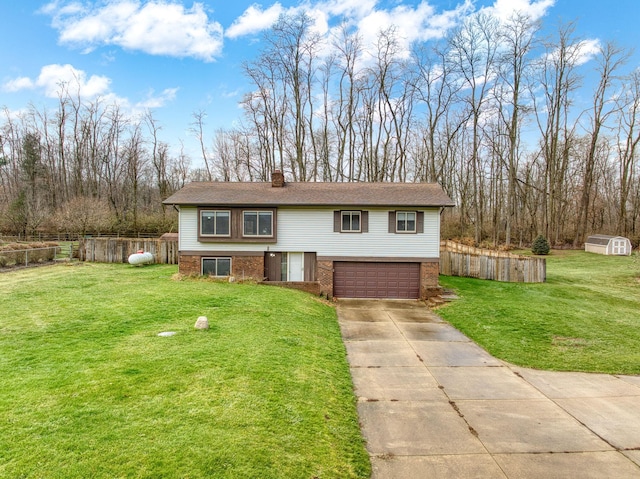 raised ranch with a front yard and a garage