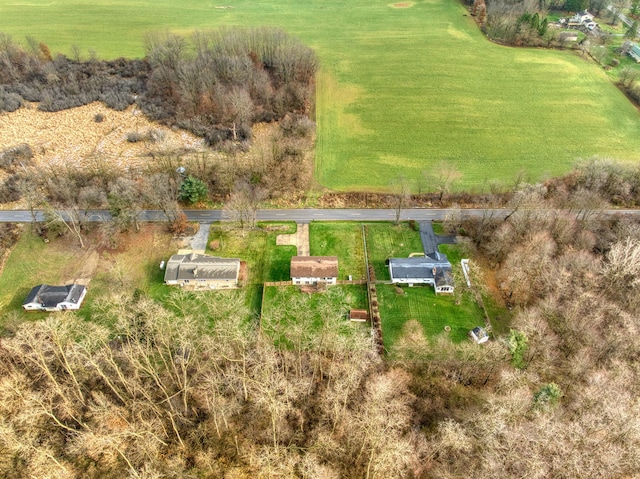 birds eye view of property with a rural view