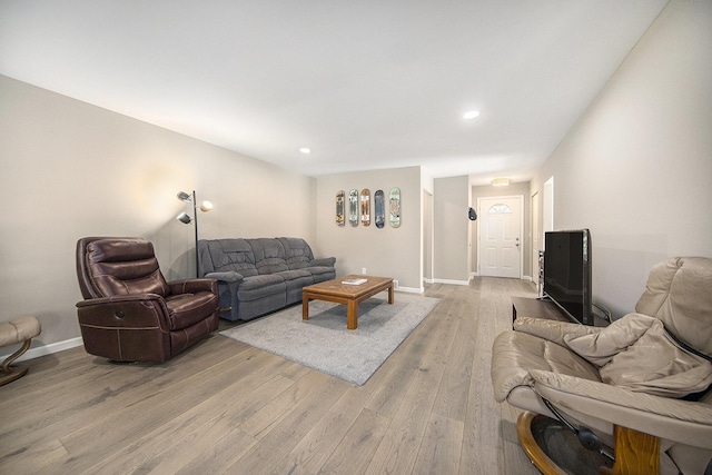 living room with light hardwood / wood-style flooring