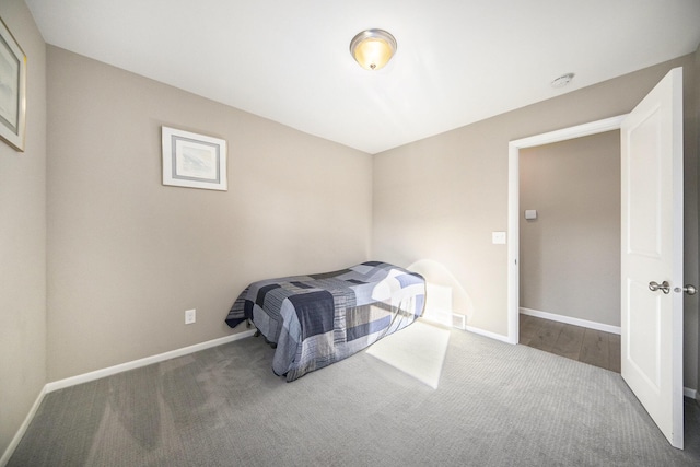 bedroom with dark carpet