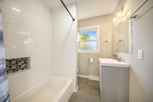 bathroom with vanity and shower / bath combination with curtain