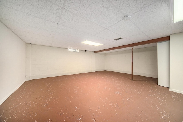 basement featuring a paneled ceiling