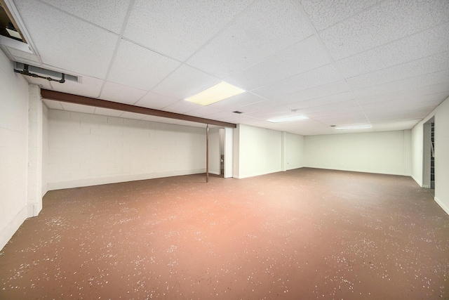 basement featuring a paneled ceiling